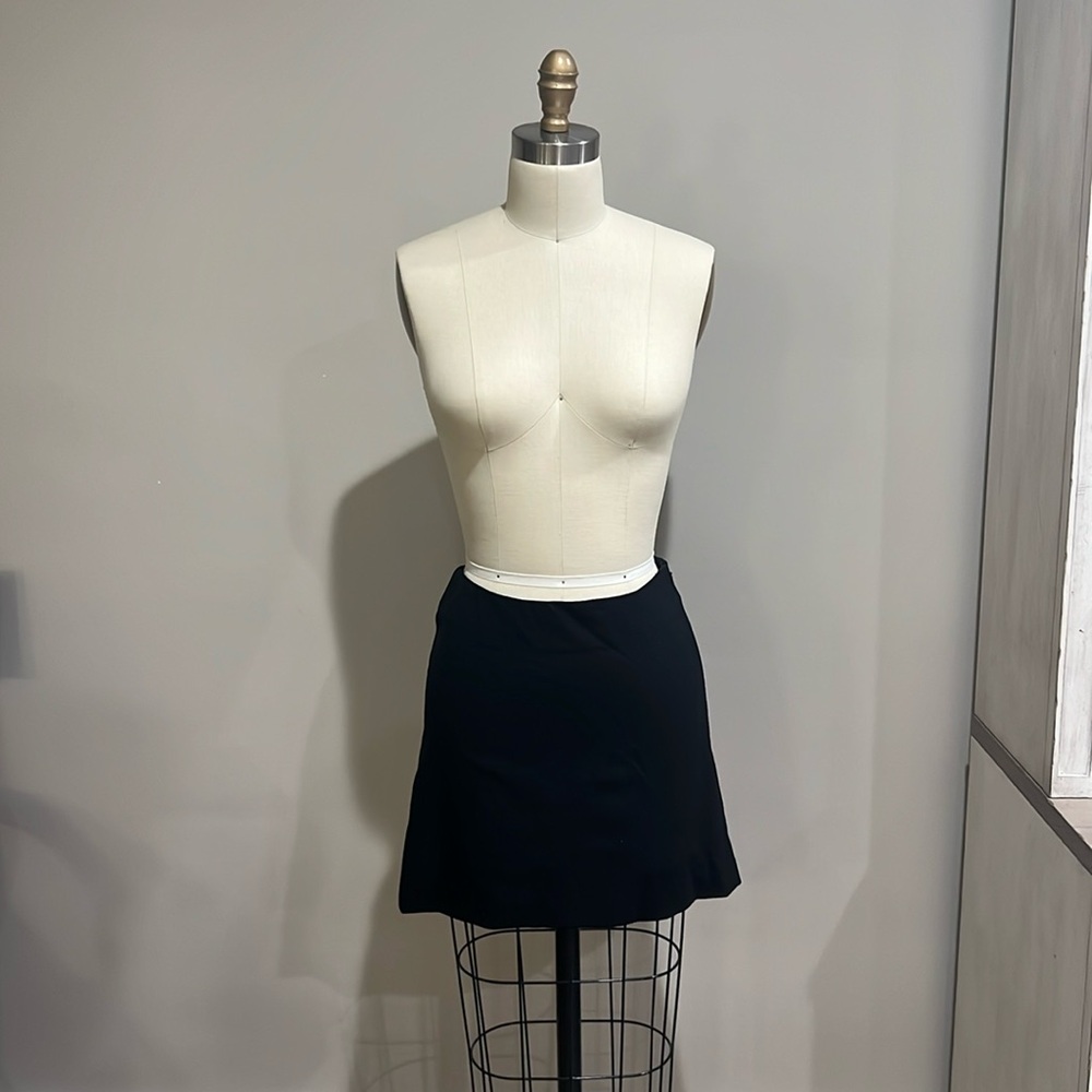 Skirt with side zipper and pleated back detail